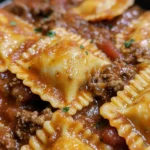 Close-up of beef ravioli in rich meat sauce