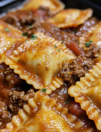 Close-up of beef ravioli in rich meat sauce