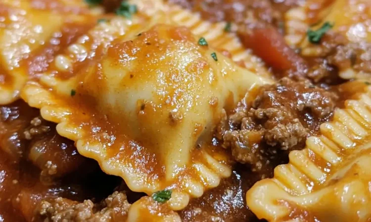 Close-up of beef ravioli in rich meat sauce