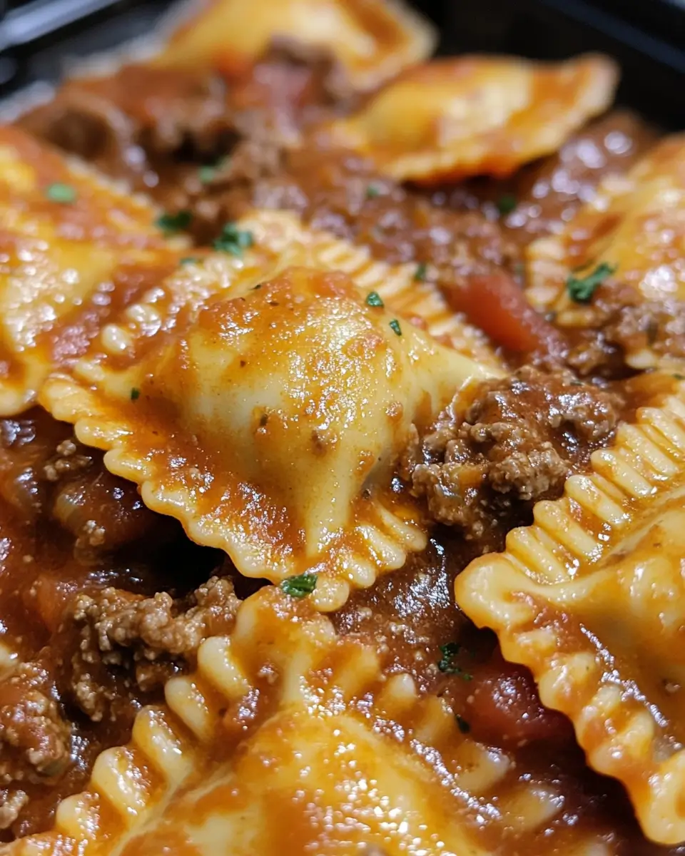 Close-up of beef ravioli in rich meat sauce
